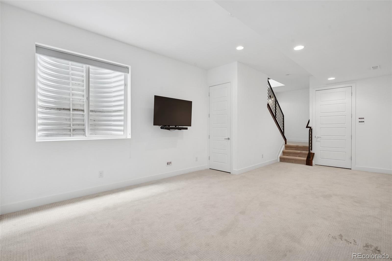 1833 East Jewell Avenue Denver, CO 80210 - Photo 32 of 41 a view of an empty room with a window