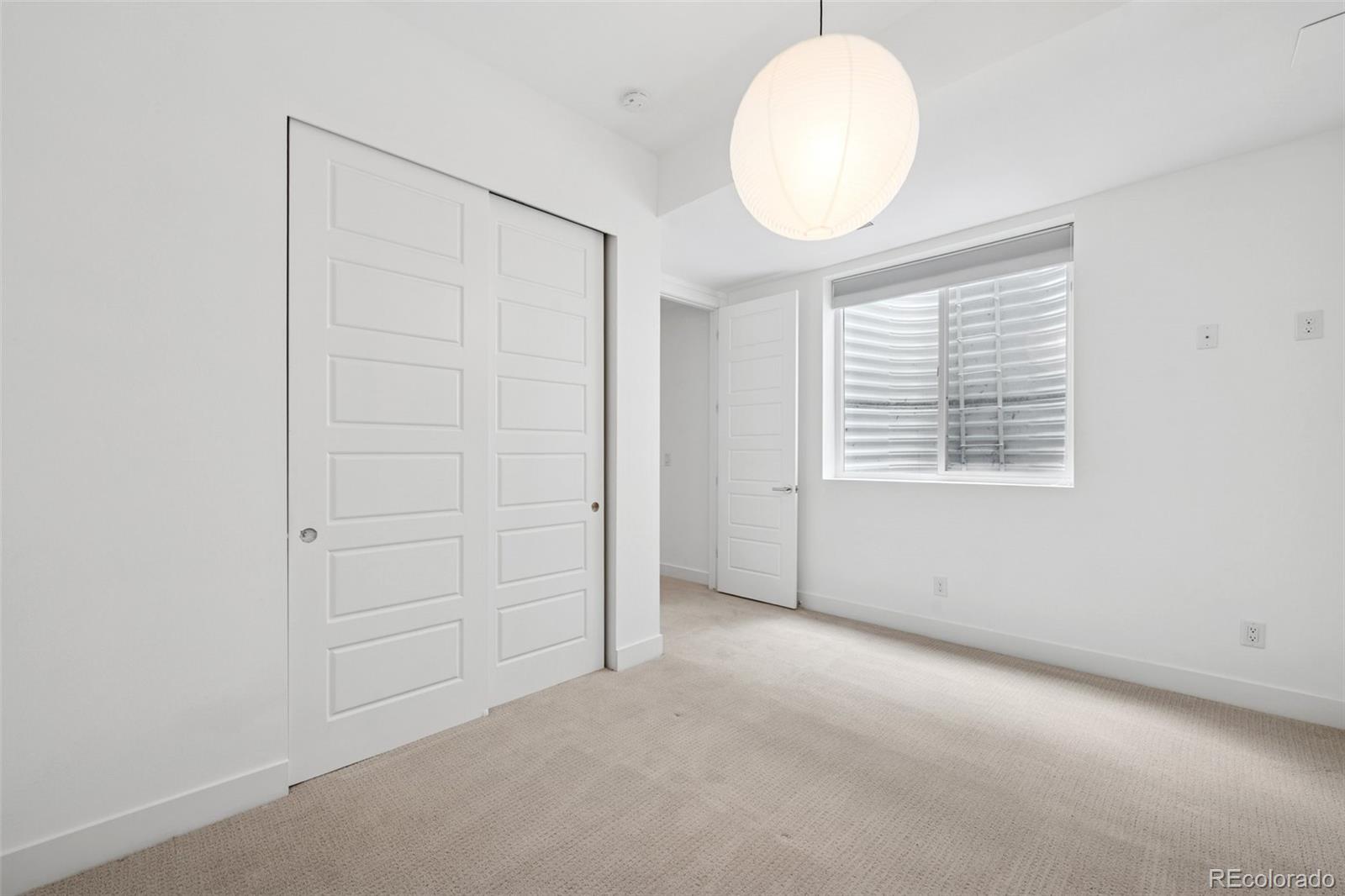 1833 East Jewell Avenue Denver, CO 80210 - Photo 35 of 41 an empty room with windows