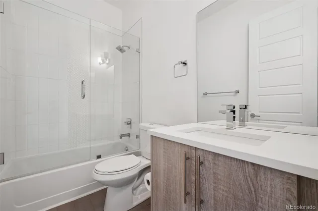 a view of a hallway with washer and dryer