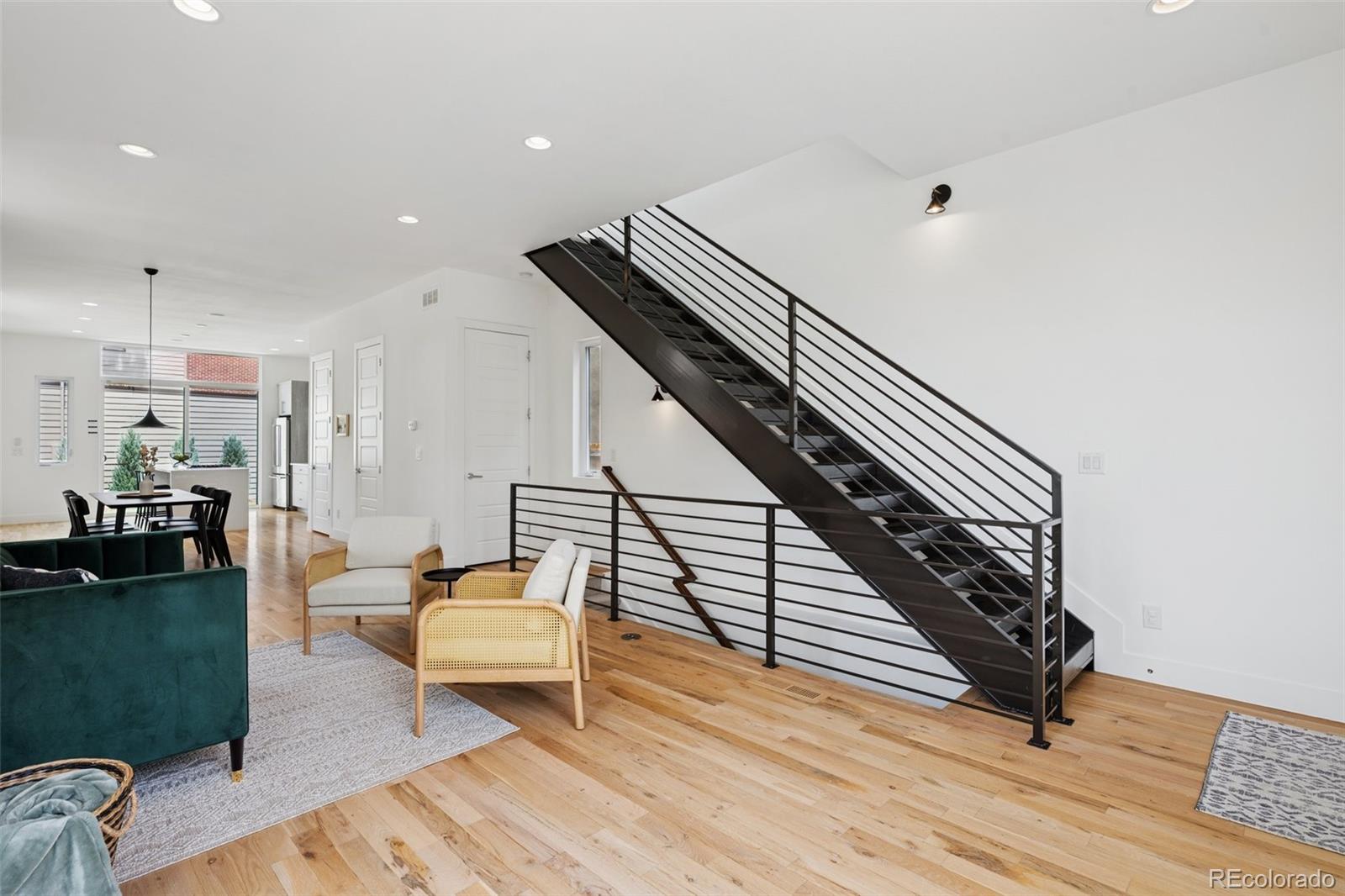 1833 East Jewell Avenue Denver, CO 80210 - Photo 6 of 41 a living room with furniture and wooden floor