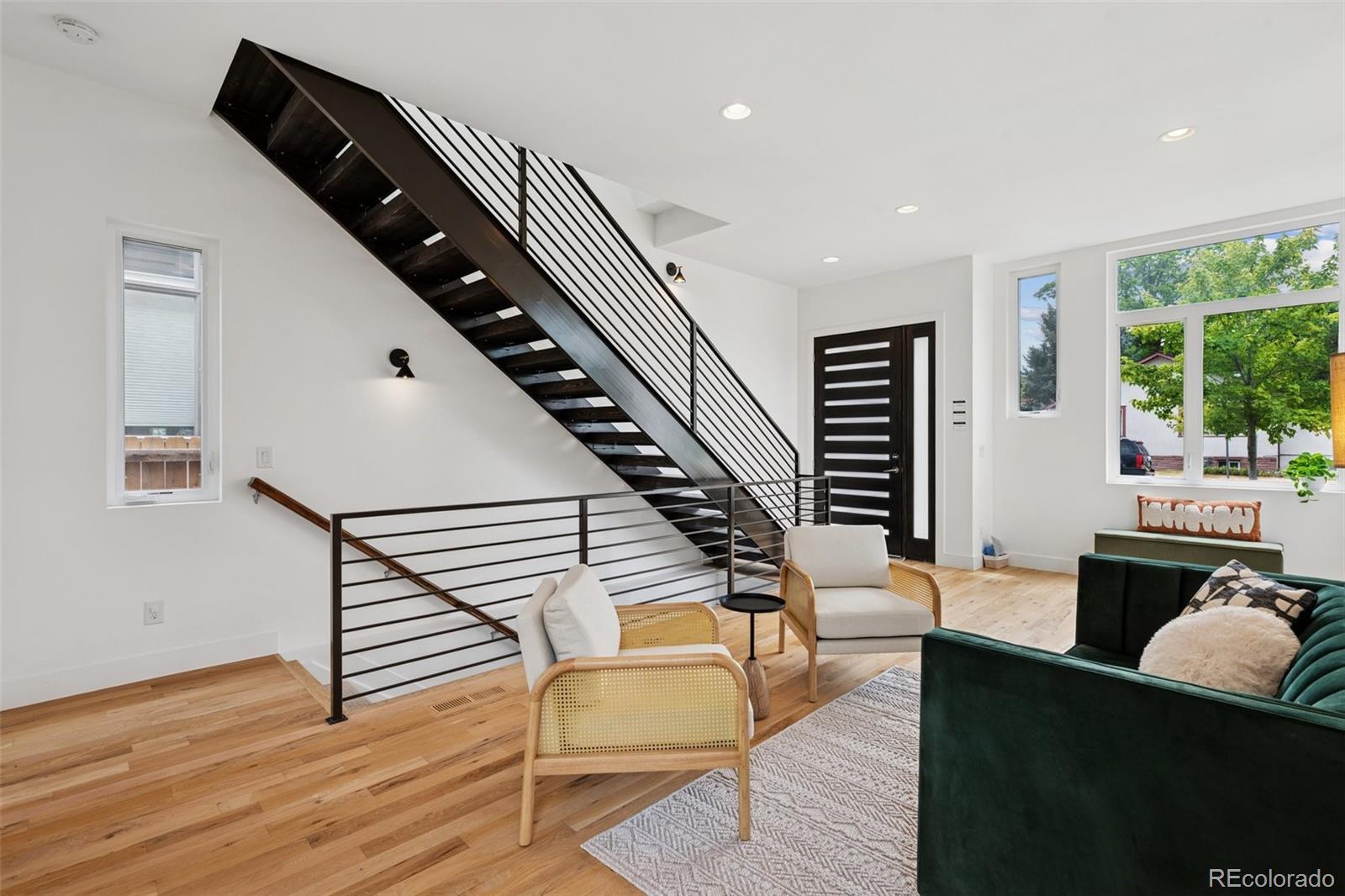 1833 East Jewell Avenue Denver, CO 80210 - Photo 8 of 41 a living room with furniture and wooden floor