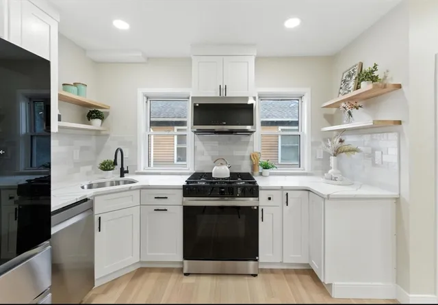 a kitchen with a stove and a sink