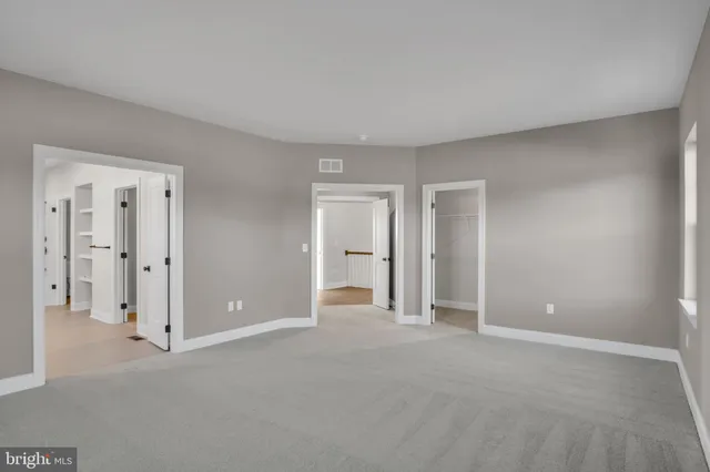 a spacious bathroom with a tub sink shower and mirror