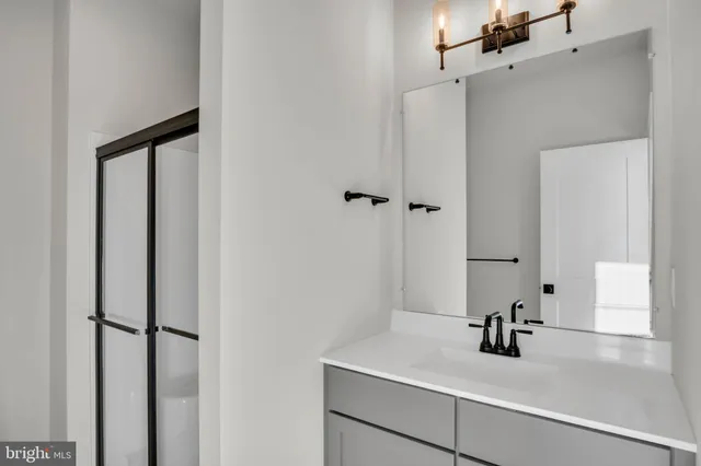 a view of an empty room and closet area