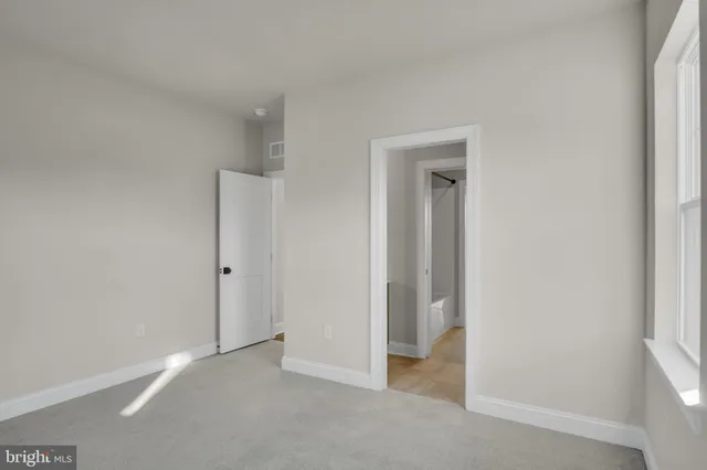 a brick house with a small yard