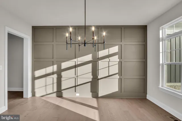 a view of an empty room with a glass door