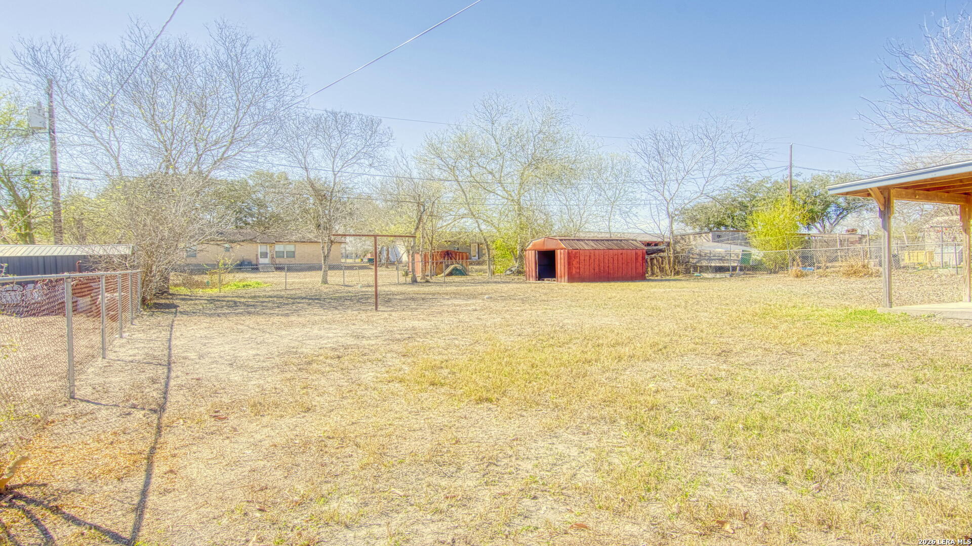 406 Pine Street Kenedy, TX 78119 - Photo 17 of 31 a view of an outdoor space and swimming pool
