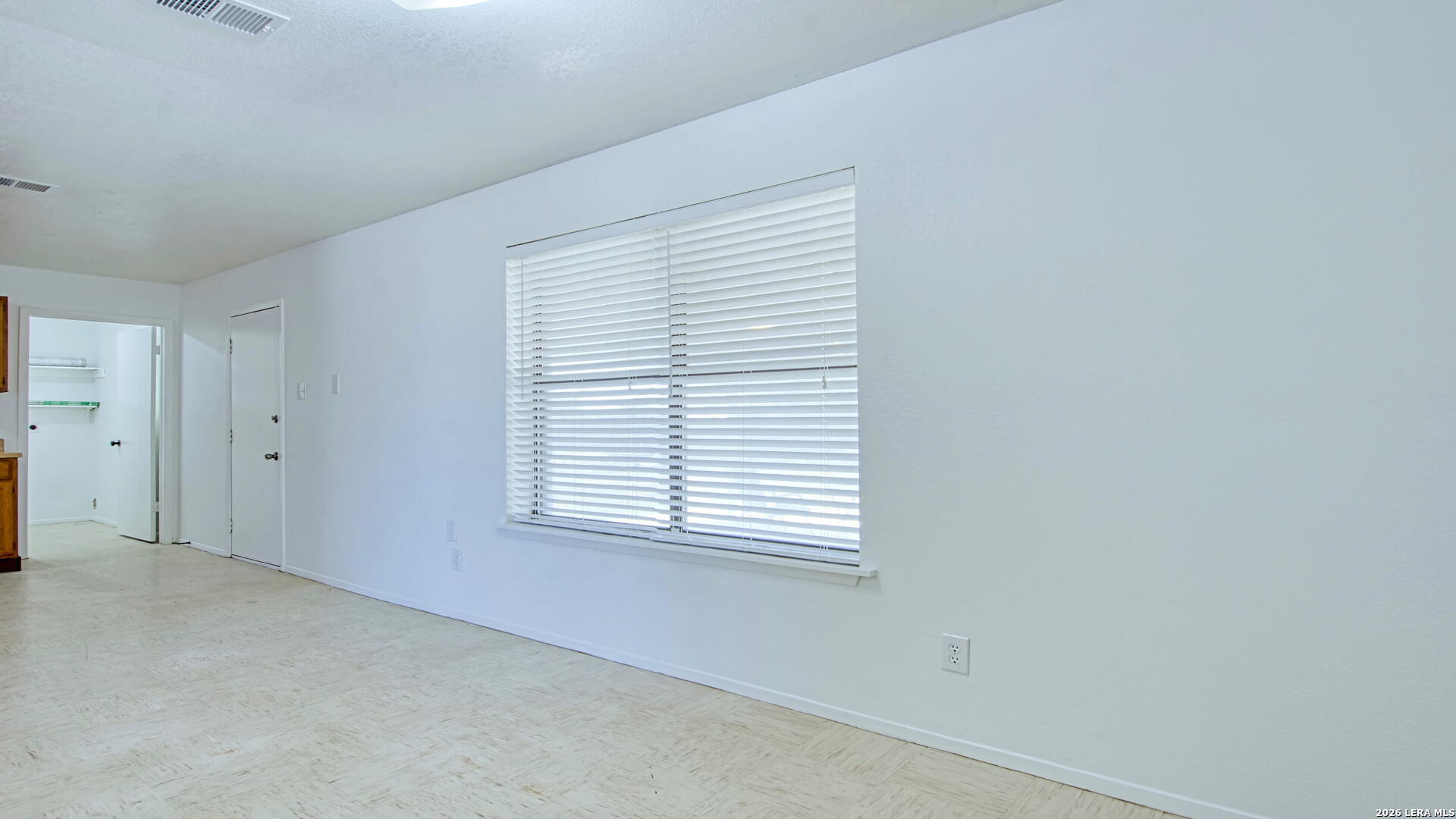 406 Pine Street Kenedy, TX 78119 - Photo 22 of 31 an empty room with a window