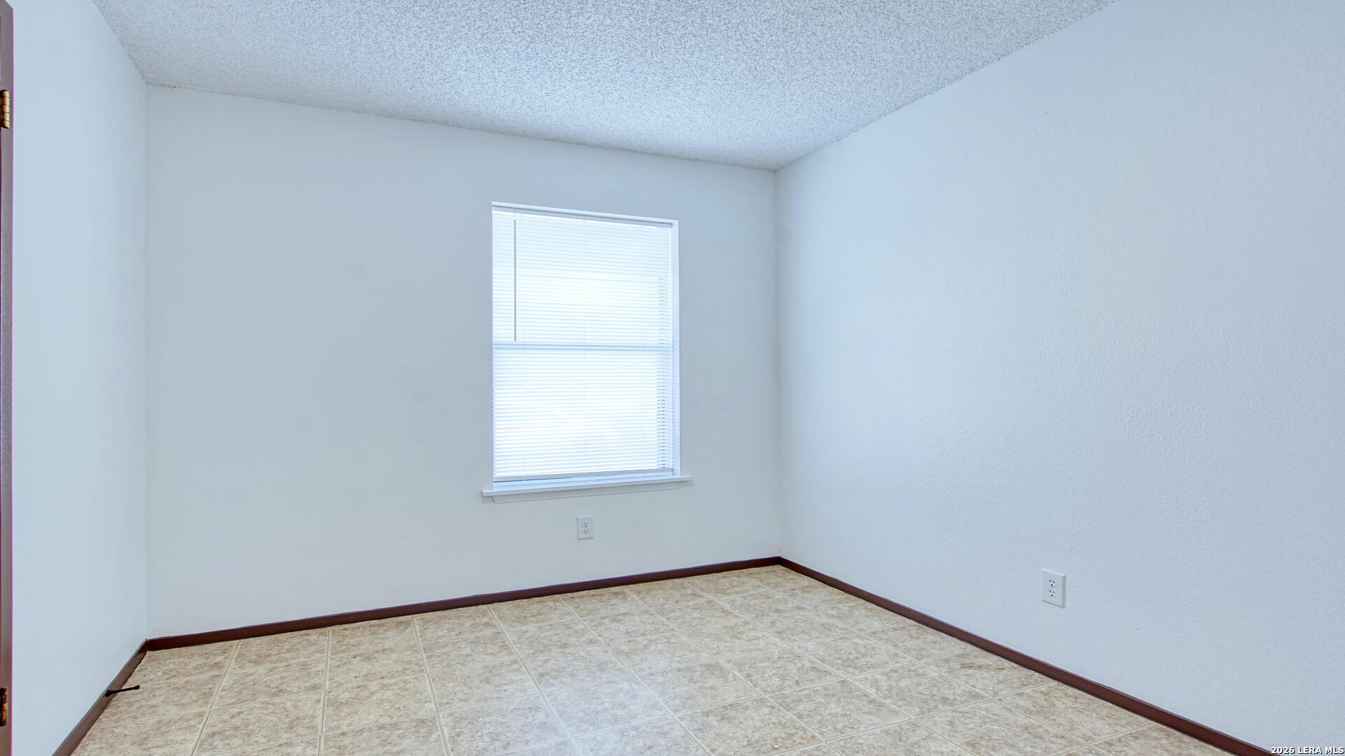 406 Pine Street Kenedy, TX 78119 - Photo 26 of 31 an empty room with a window