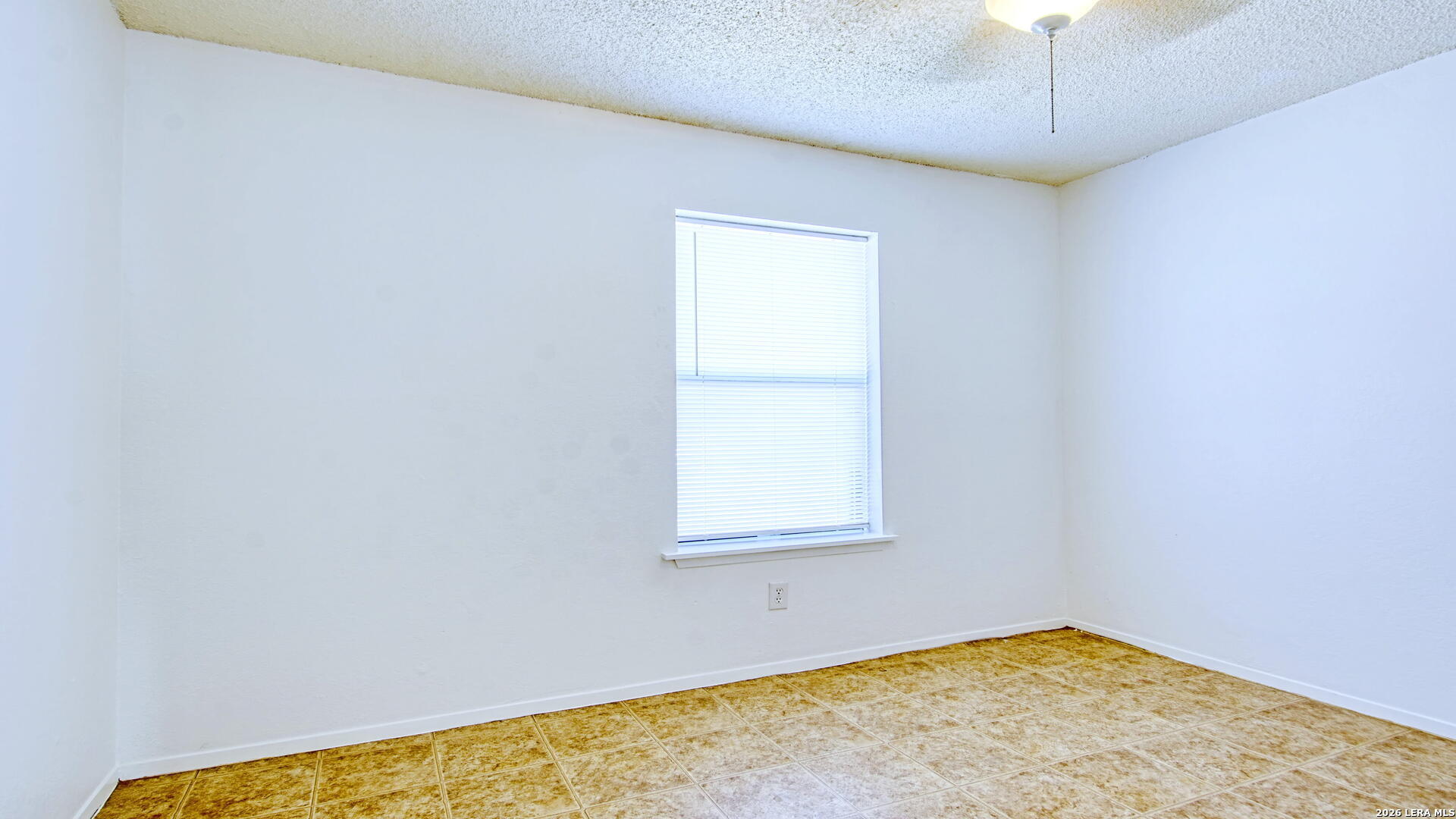 406 Pine Street Kenedy, TX 78119 - Photo 29 of 31 an empty room with a window