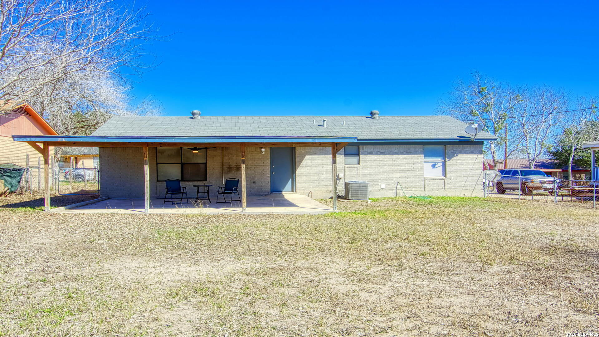 406 Pine Street Kenedy, TX 78119 - Photo 7 of 31 a front view of a house with a yard