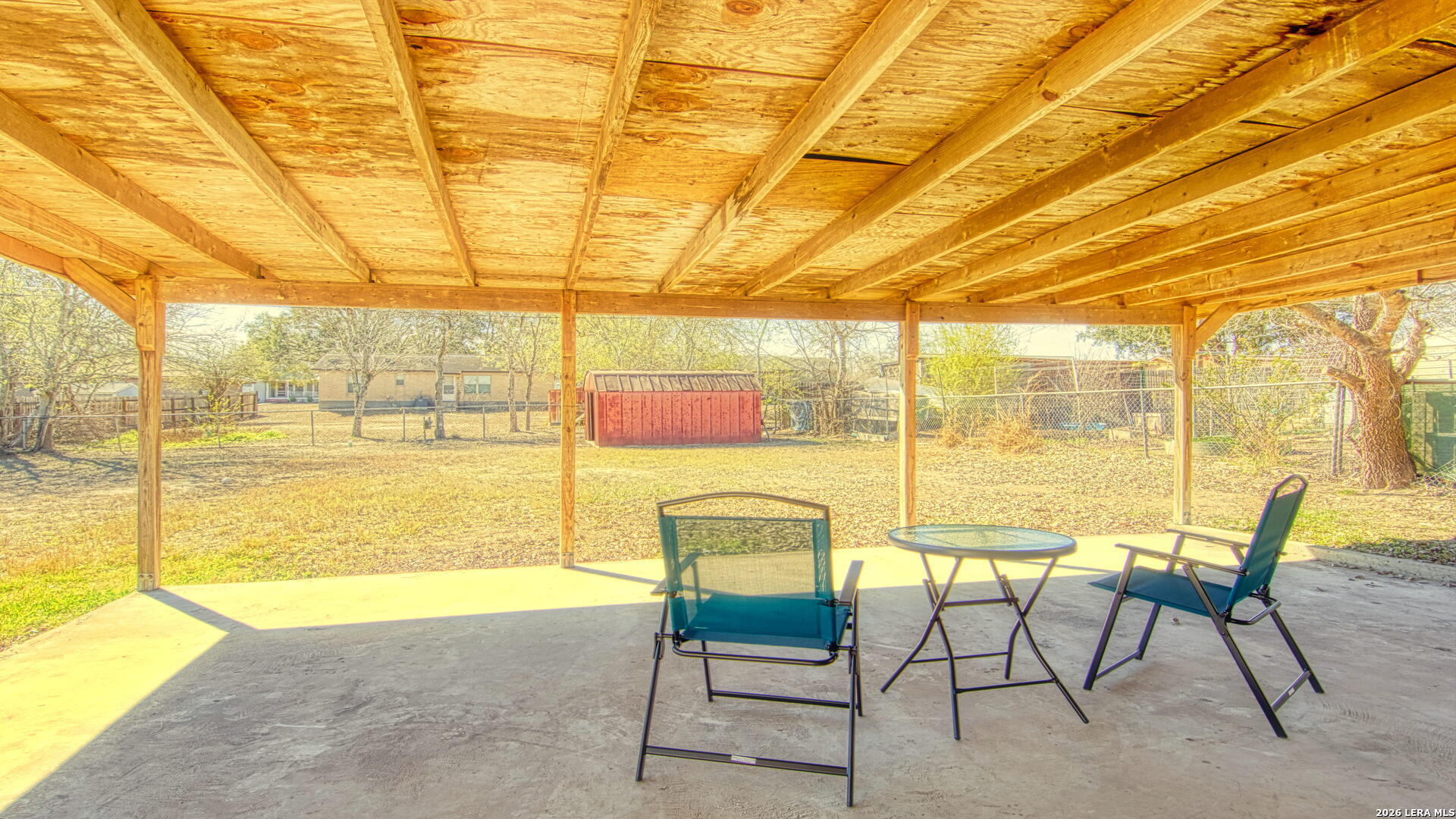 406 Pine Street Kenedy, TX 78119 - Photo 8 of 31 a view of a swimming pool with a table and chairs