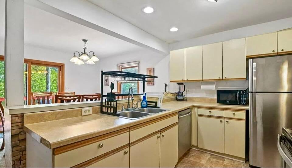 266 Image Drive Scotrun, PA 18355 - Photo 5 of 23 a kitchen with stainless steel appliances a sink stove and refrigerator