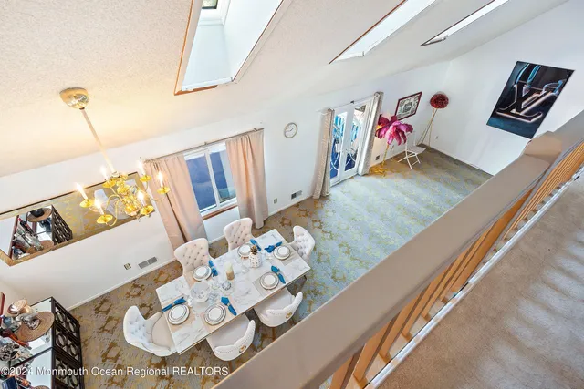 a view of living room with furniture and wooden floor