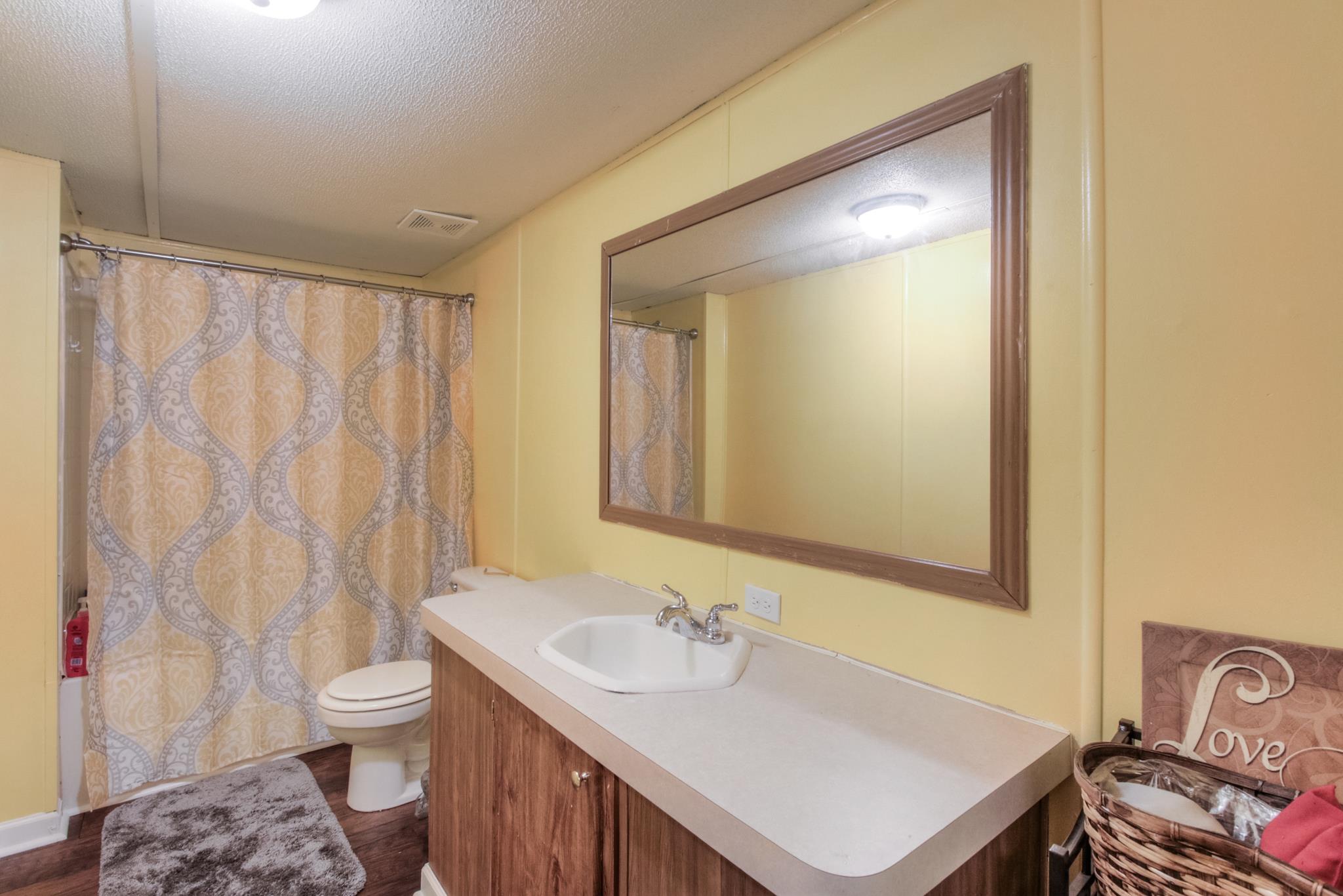 262 Dorris Road Portland, TN 37148 - Photo 14 of 29 a bathroom with a sink toilet and shower