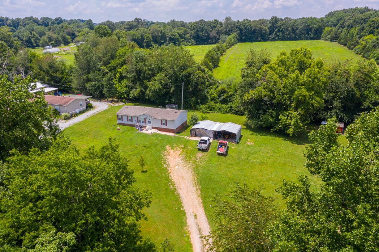 262 Dorris Road Portland, TN 37148 - Photo 23 of 29 a view of yard with swimming pool and green space