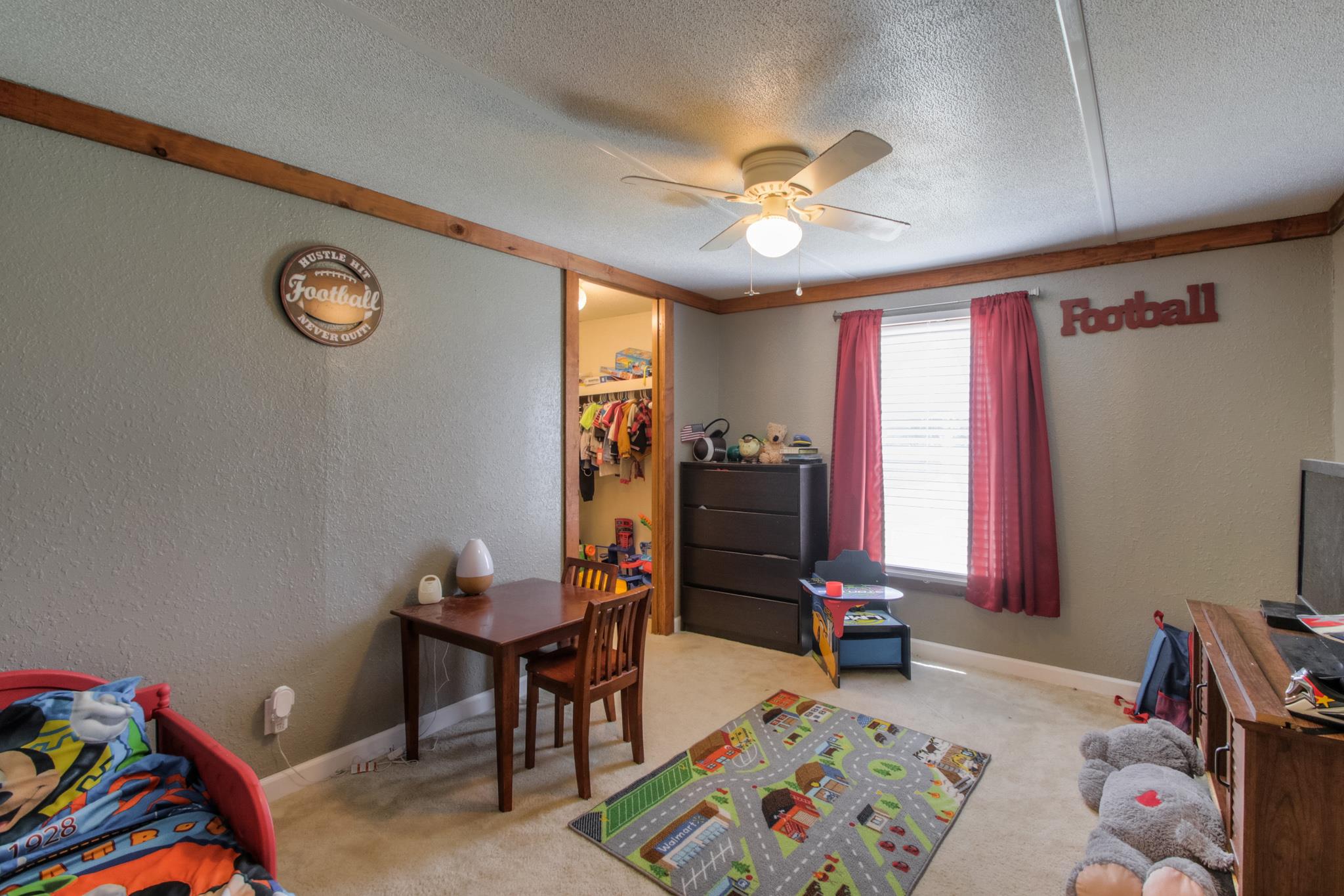 262 Dorris Road Portland, TN 37148 - Photo 24 of 29 a living room with furniture and a flat screen tv