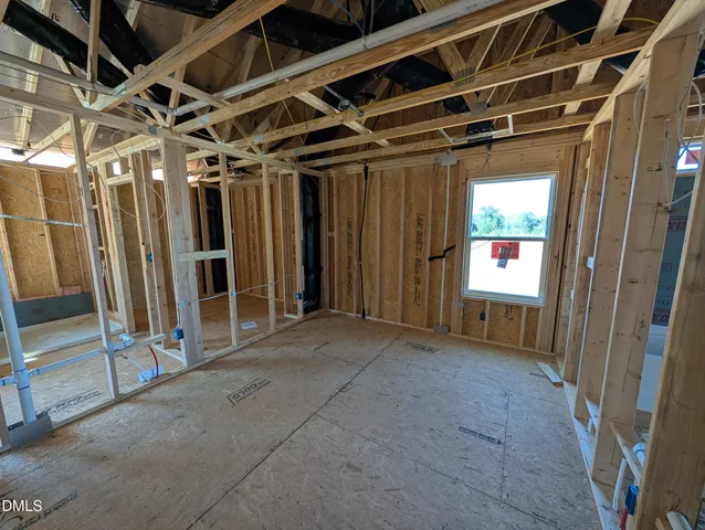a view of an empty room with wooden walls