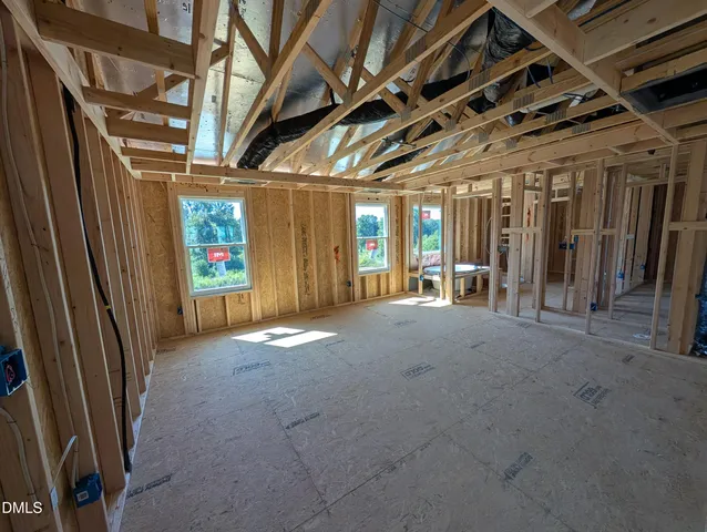 a view of an empty room with glass door