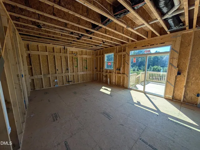 a view of a room with wooden walls