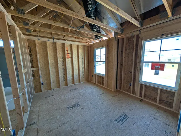 a view of a room with wooden walls