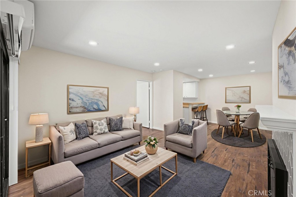 6911 Quail Place, Unit C Carlsbad, CA 92009 - Photo 1 of 18 a living room with furniture a rug and a painting