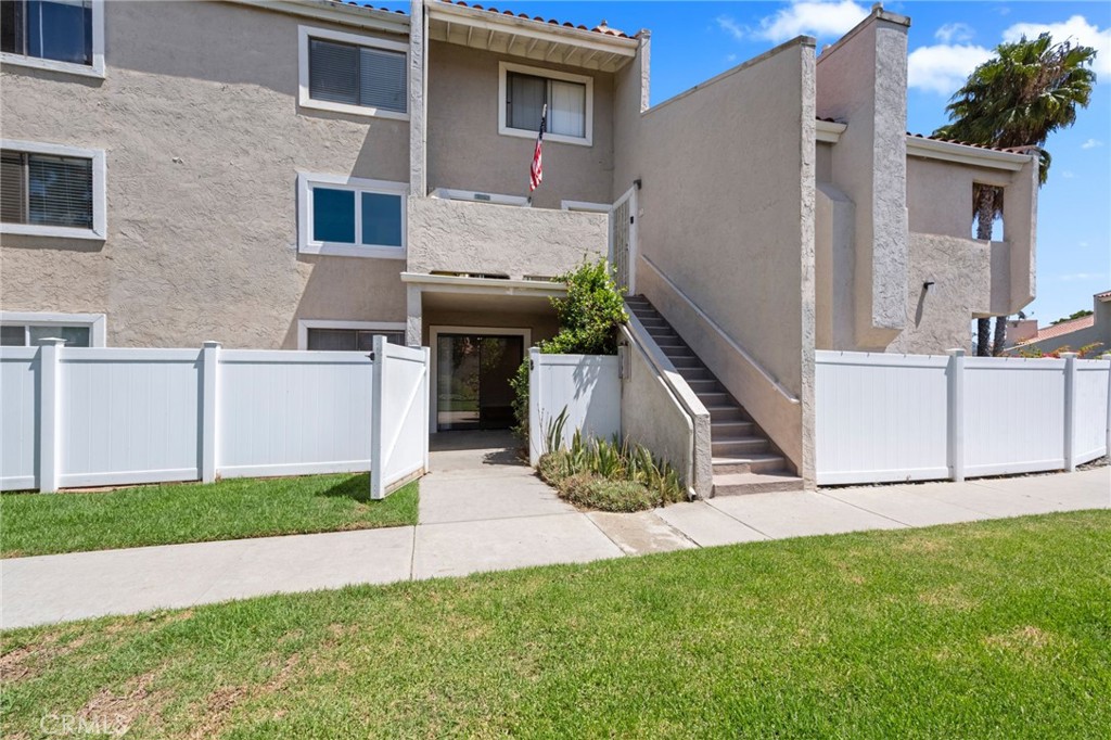 6911 Quail Place, Unit C Carlsbad, CA 92009 - Photo 12 of 18 a view of front of house with a yard
