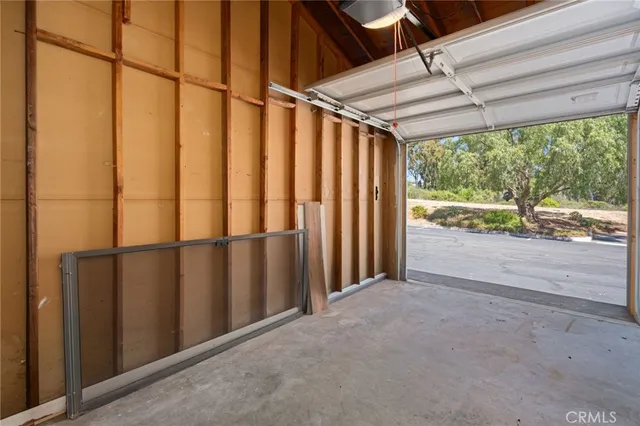 a view of a swimming pool with a patio and plants
