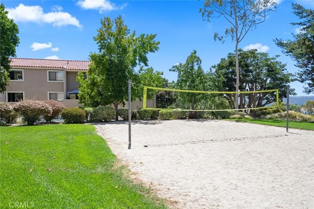 a sign that is sitting in front of flowers