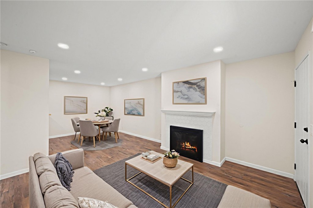 6911 Quail Place, Unit C Carlsbad, CA 92009 - Photo 2 of 18 a living room with furniture and a fireplace