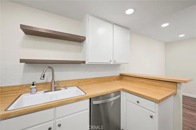 a kitchen with a sink and cabinets