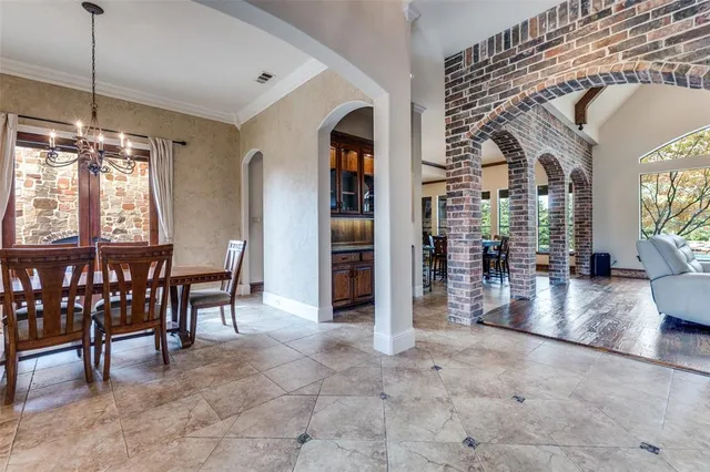 a view of a dining room with furniture and window