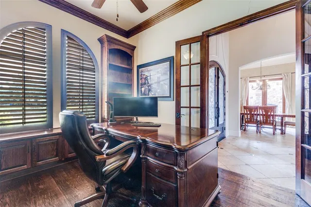 a workspace with furniture and a flat screen tv