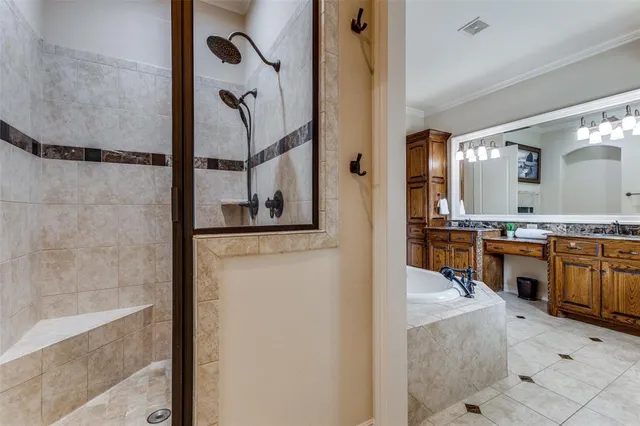 a view of a bathroom with shower and bathtub