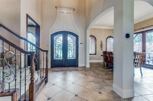 a view of entryway and hallway with a front door