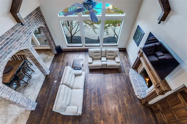 a view of living room with furniture and a floor to ceiling window