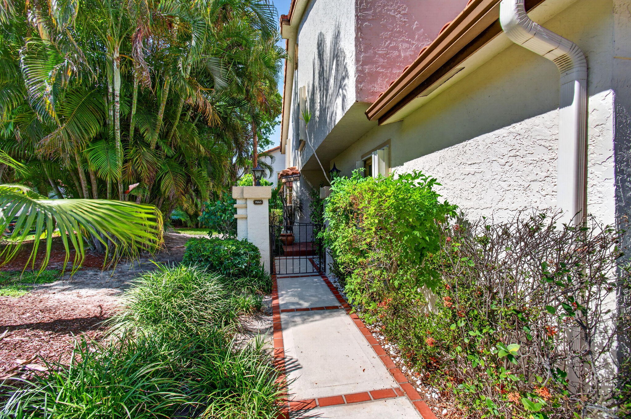 7865 La Mirada Drive Boca Raton, FL 33433 - Photo 61 of 62 Pathway to side entrance