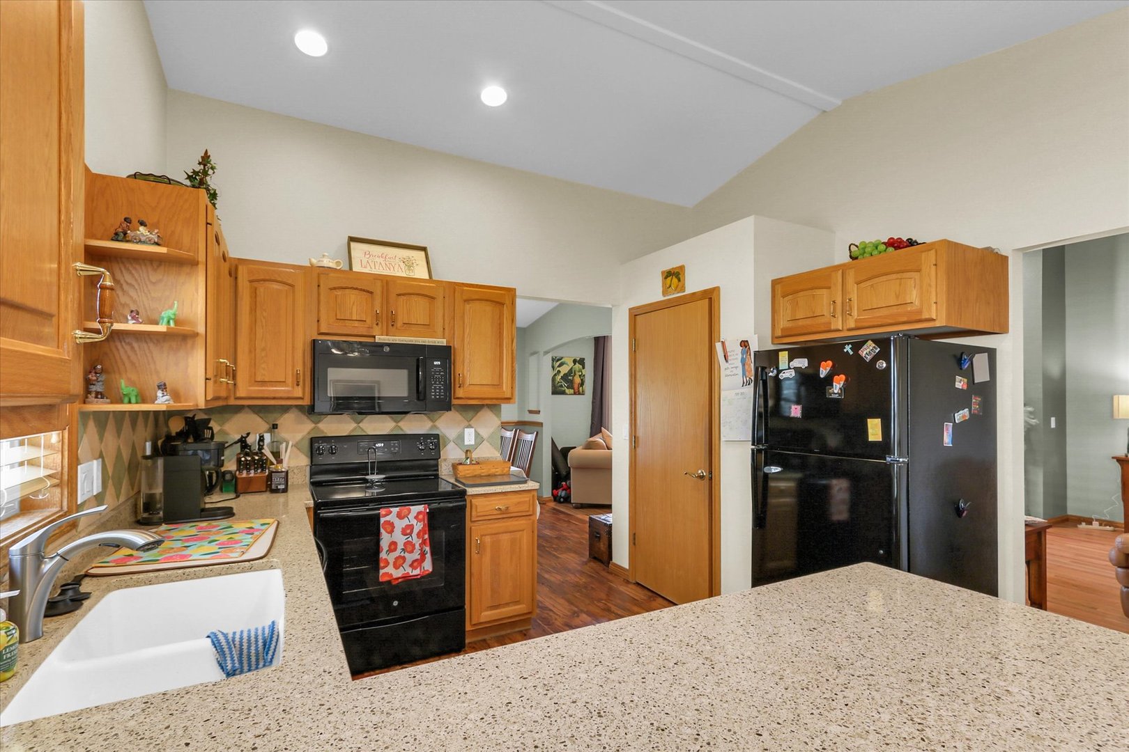 3110 Ridge Park Road Urbana, IL 61802 - Photo 11 of 26 a kitchen with stainless steel appliances kitchen island granite countertop a refrigerator stove and sink