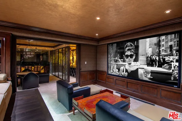 a view of a hallway with wooden floor and stairs