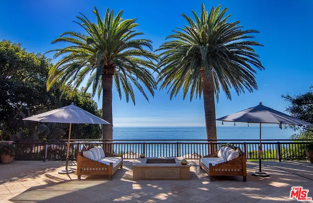 a backyard of a house with seating space