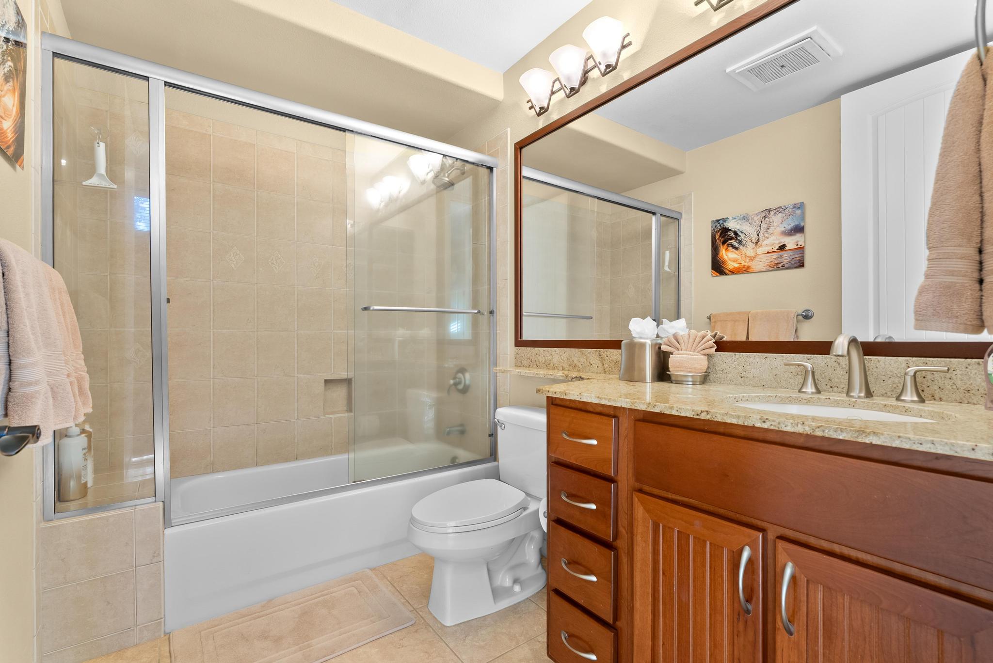 68-1122 Na Ala Hele Road, Unit Q4 Kamuela, HI 96743 - Photo 13 of 30 a bathroom with a granite countertop sink a toilet a mirror and shower