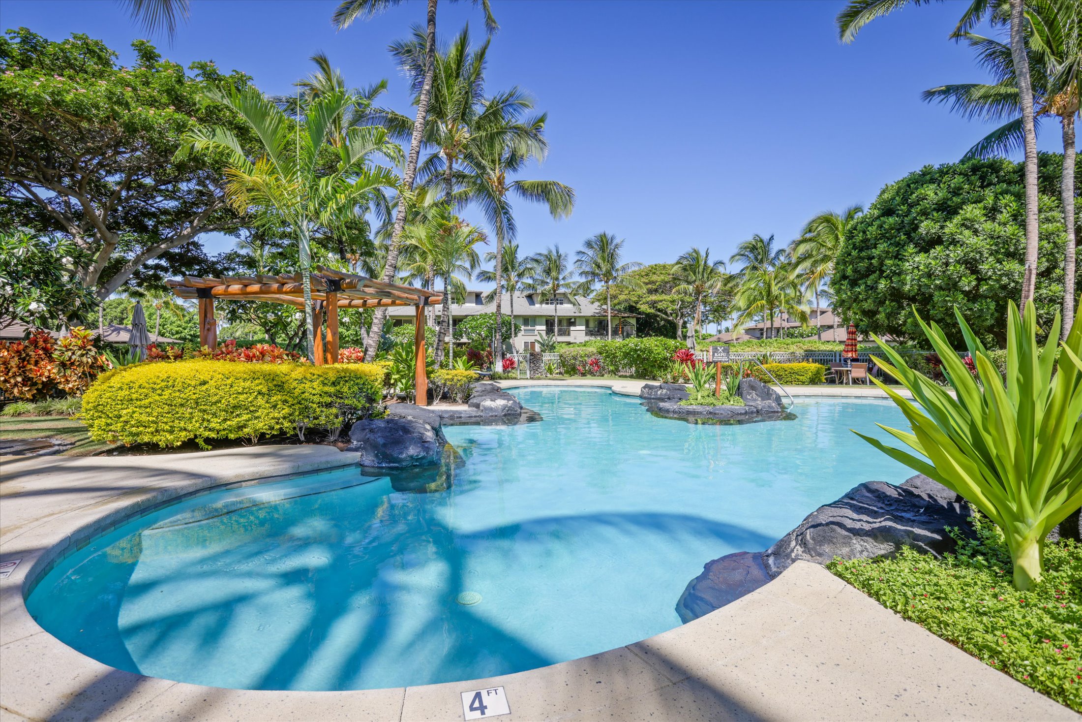 68-1122 Na Ala Hele Road, Unit Q4 Kamuela, HI 96743 - Photo 28 of 30 a view of a swimming pool with a sitting space