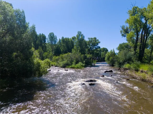 a view of a street with a yard