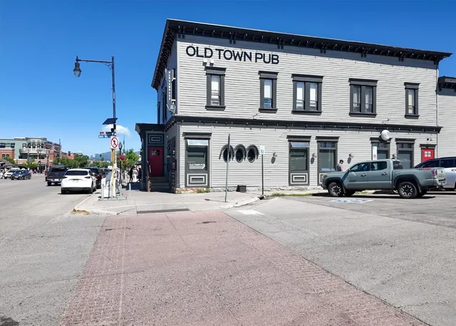 a large body of water with a building in the background