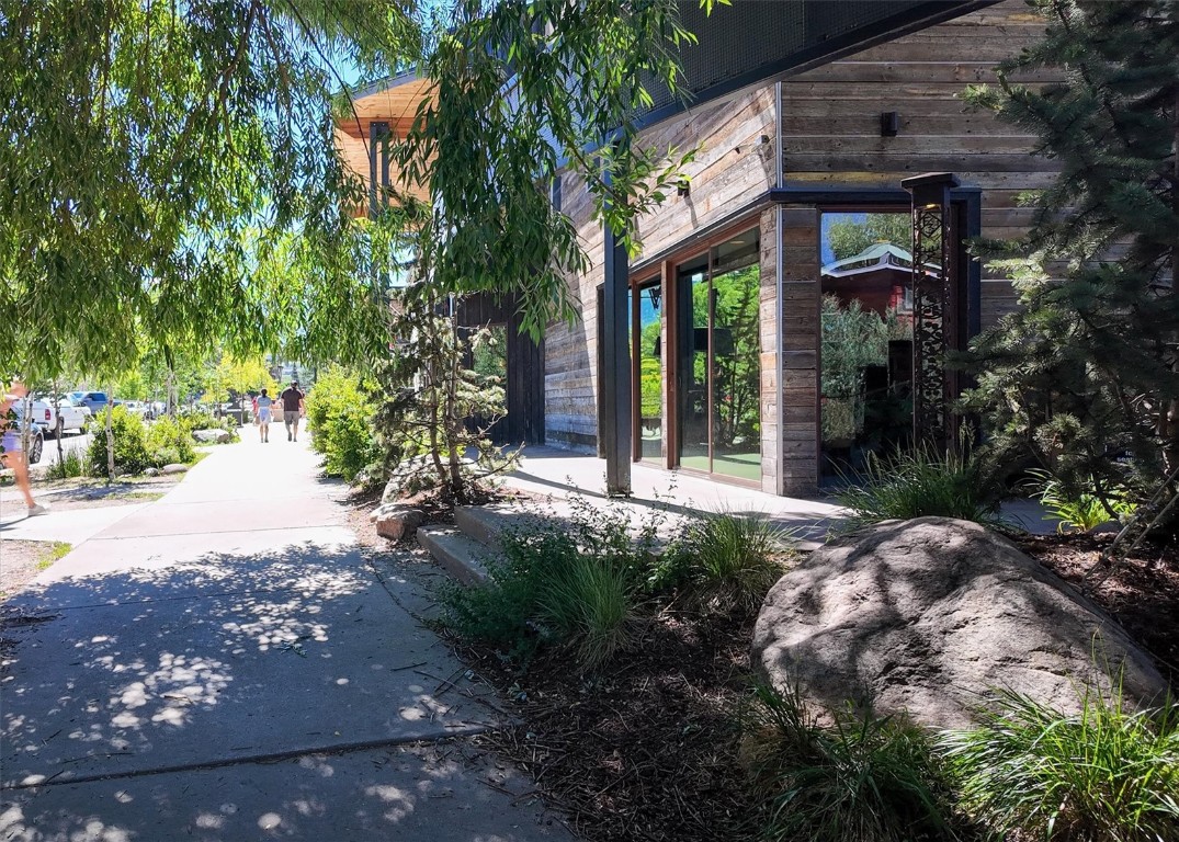 303 Riverview Way Steamboat Springs, CO 80487 - Photo 32 of 44 a front view of a house with garden