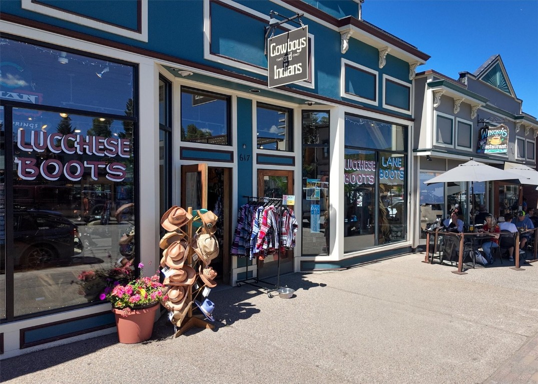303 Riverview Way Steamboat Springs, CO 80487 - Photo 33 of 44 a front view of a building with table and chairs