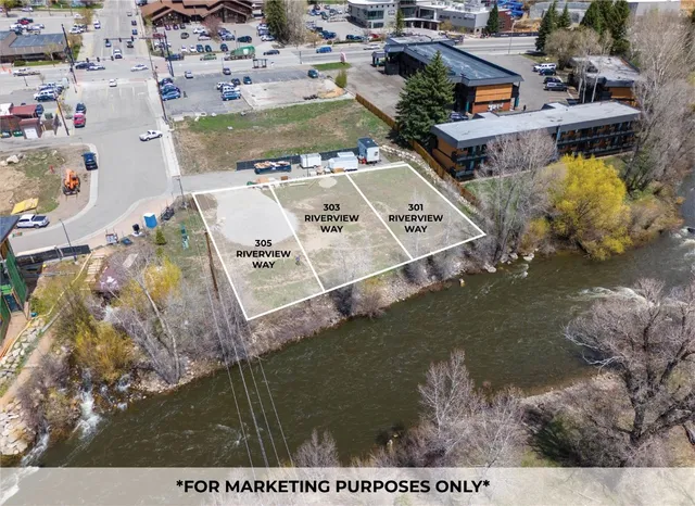 a view of a street with a yard