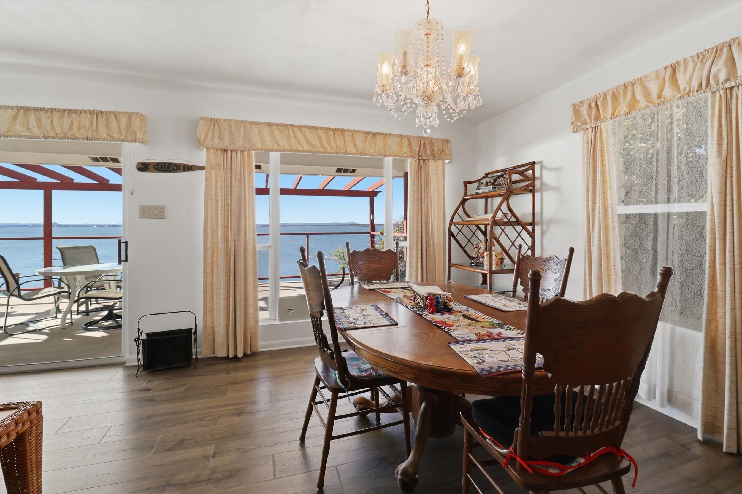 919 Lakeshore Loop Tow, TX 78672 - Photo 6 of 33 a view of a dining room with furniture window and wooden floor