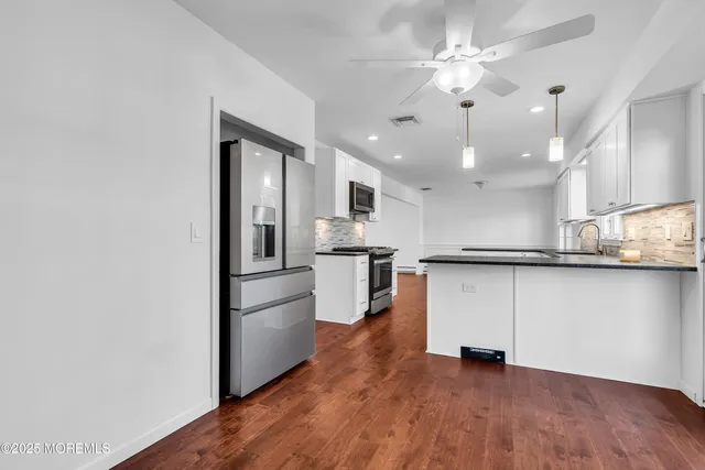 a bathroom with a toilet and a bathtub