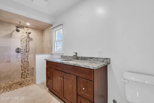 a view of a yard with snow on the road